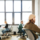 colleagues-work-office-using-computers-looking-aside-scaled (1)